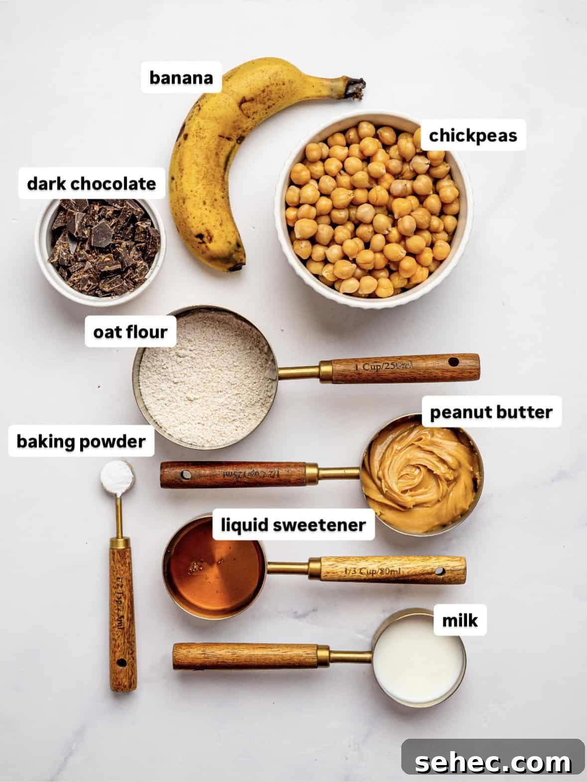 Gooey Chickpea Cookie Bars 4 Ingredients needed to make chickpea cookie bars laid out on a counter top.
