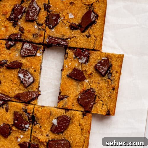 Gooey Chickpea Cookie Bars 10 Bird's eye view of healthy cookie bars on a sheet of white parchment paper.