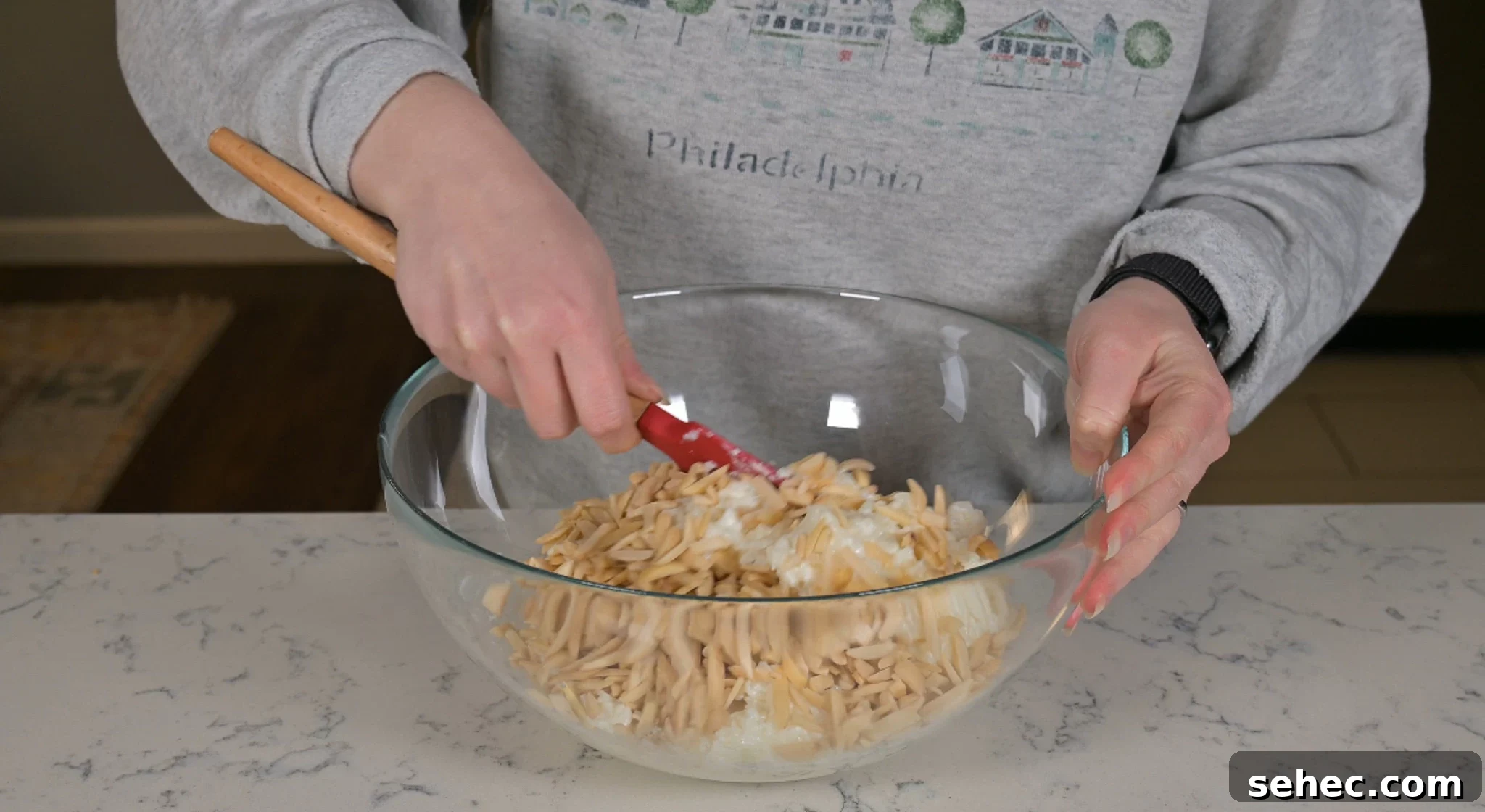 Risalamande Danish Rice Pudding with Almonds 11 Adding slivered almonds into the leftover rice porridge.