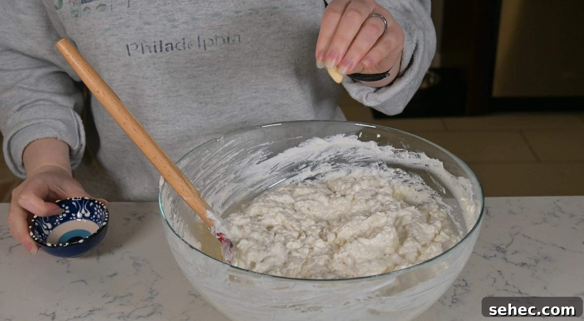 Risalamande Danish Rice Pudding with Almonds 16 Adding a whole almond to the rice pudding.
