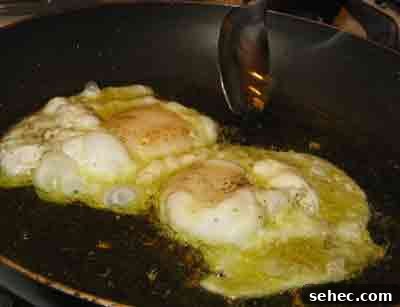 How to Fry Eggs Like a Greek Mom 6 Basting eggs for mama and zoe for greek recipe for fried eggs.