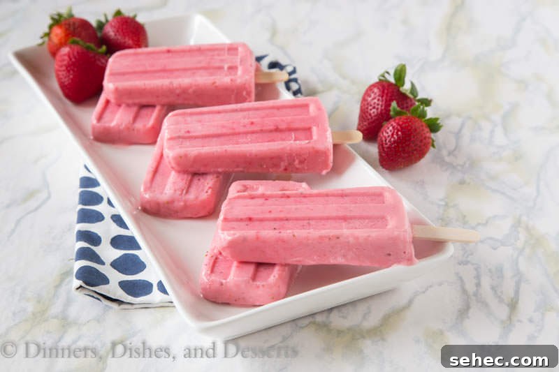 Strawberry Greek Yogurt Popsicles Recipe 4 strawberry greek yogurt popsicles on a plate