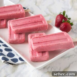 Strawberry Greek Yogurt Popsicles Recipe 5 strawberry greek yogurt popsicles on a plate