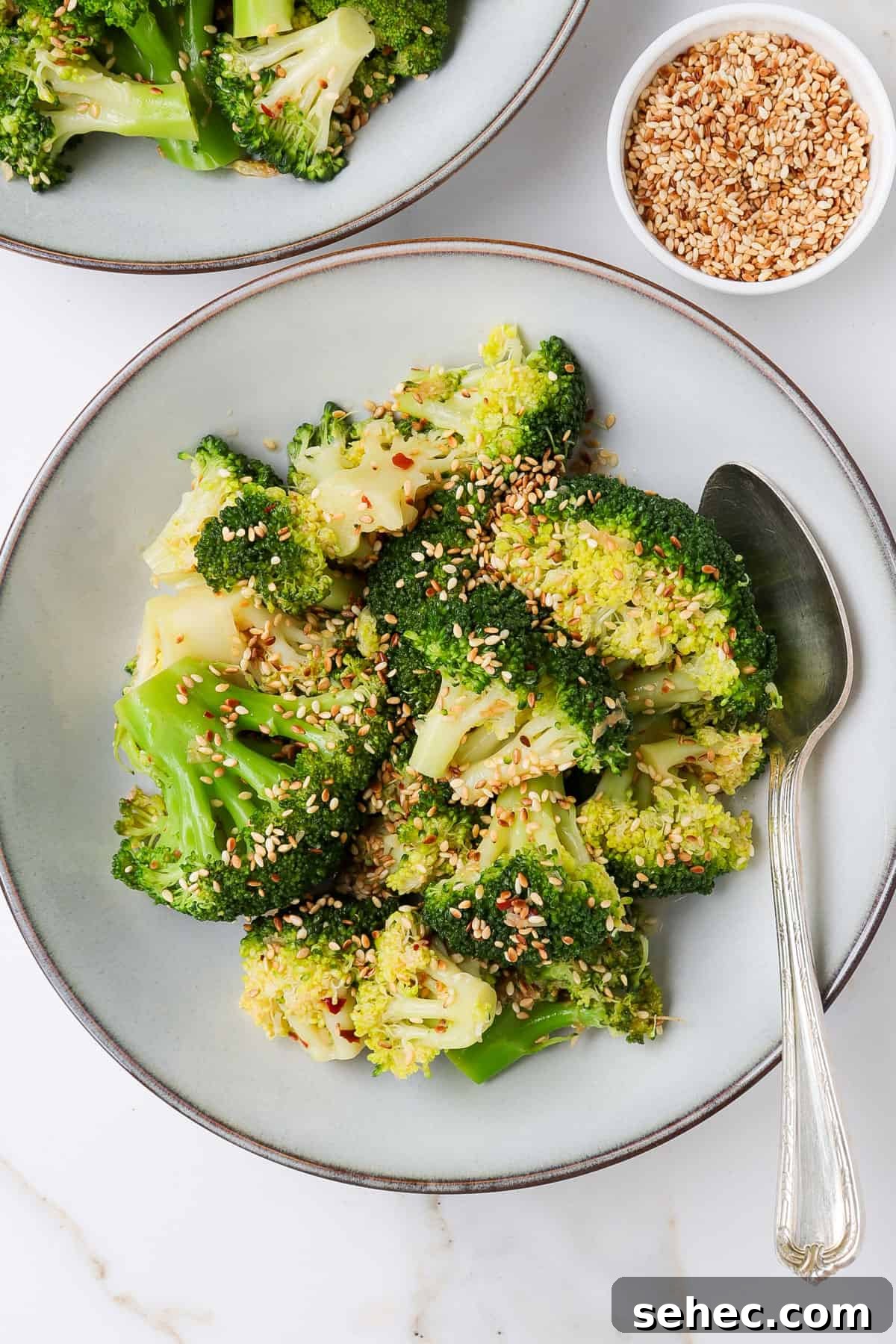Korean Broccoli Banchan Side Dish Recipe 2 Korean broccoli served in a bowl with a spoon.