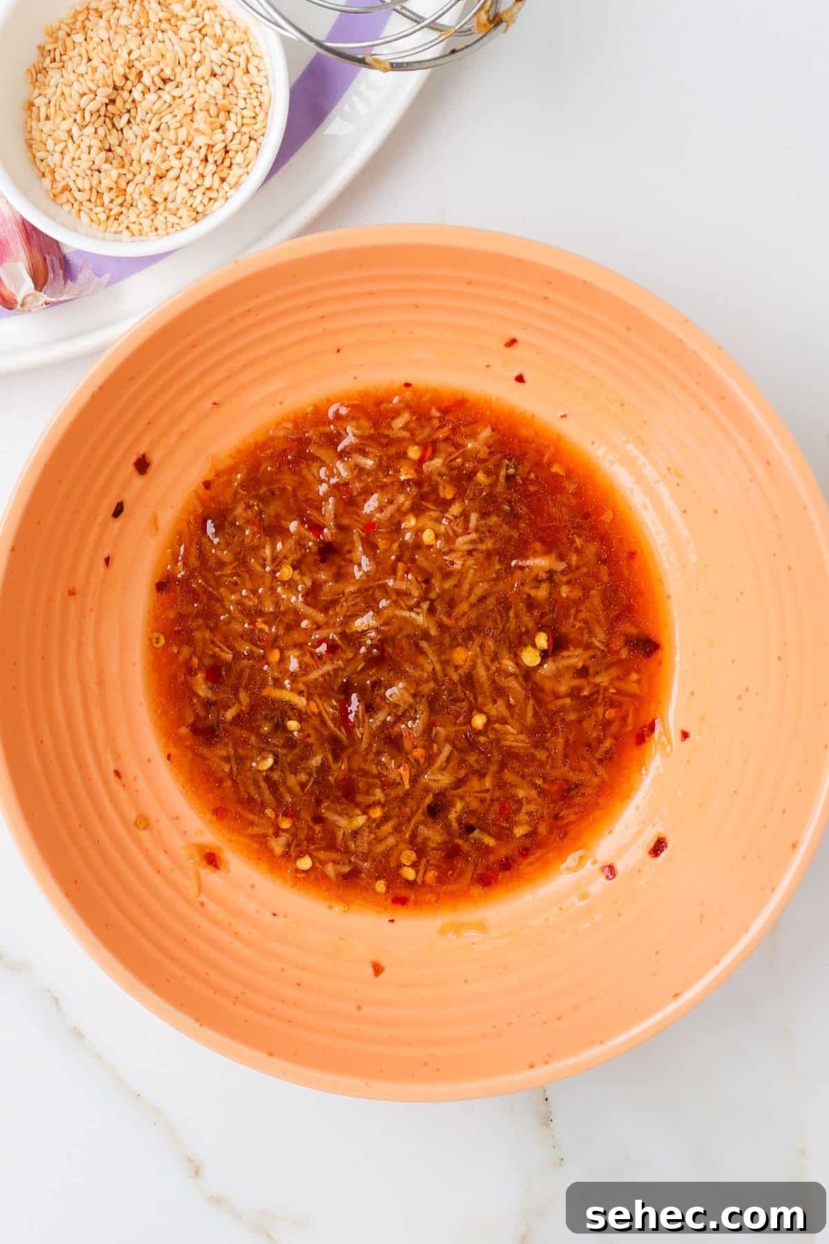 Korean Broccoli Banchan Side Dish Recipe 7 Chilli sesame oil sauce in a bowl.