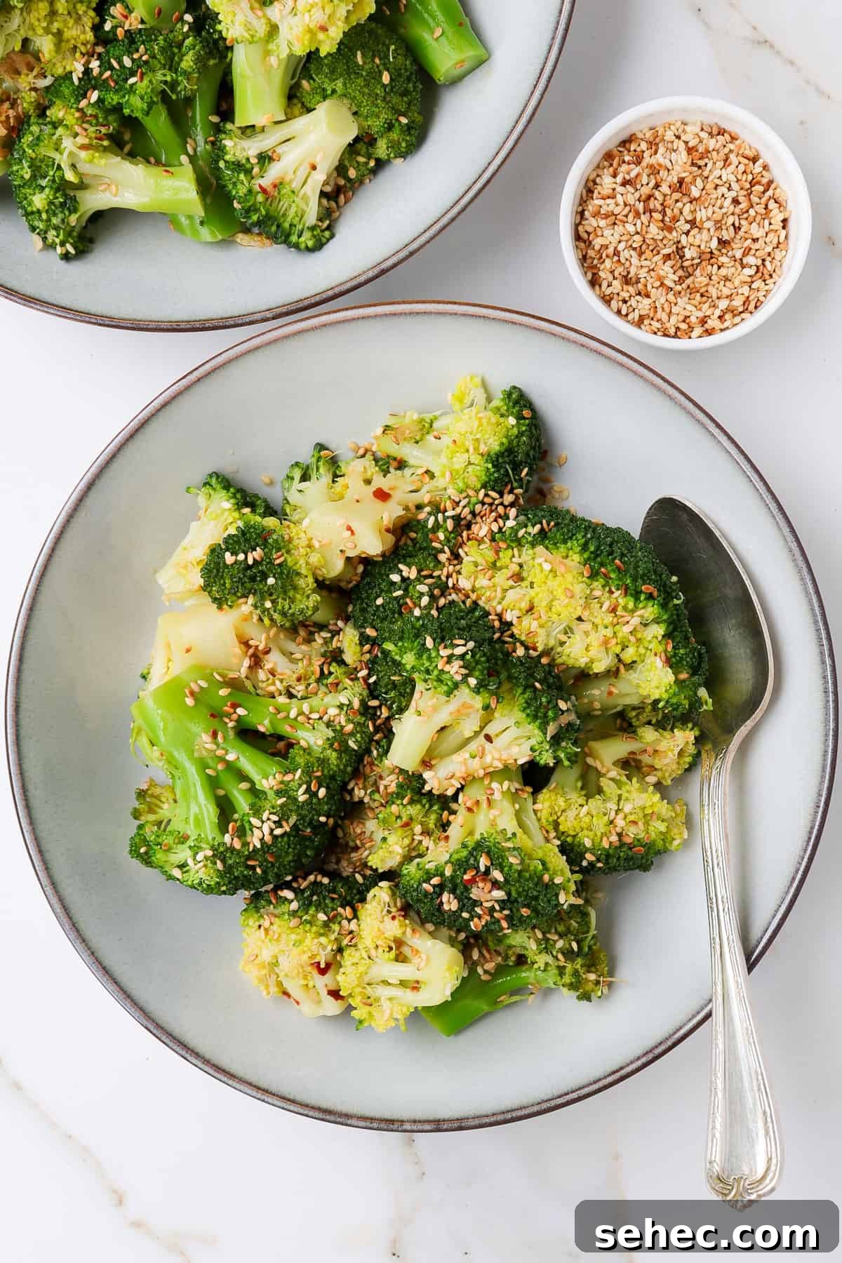 Korean Broccoli Banchan Side Dish Recipe 10 Broccoli banchan in a bowl with a spoon.