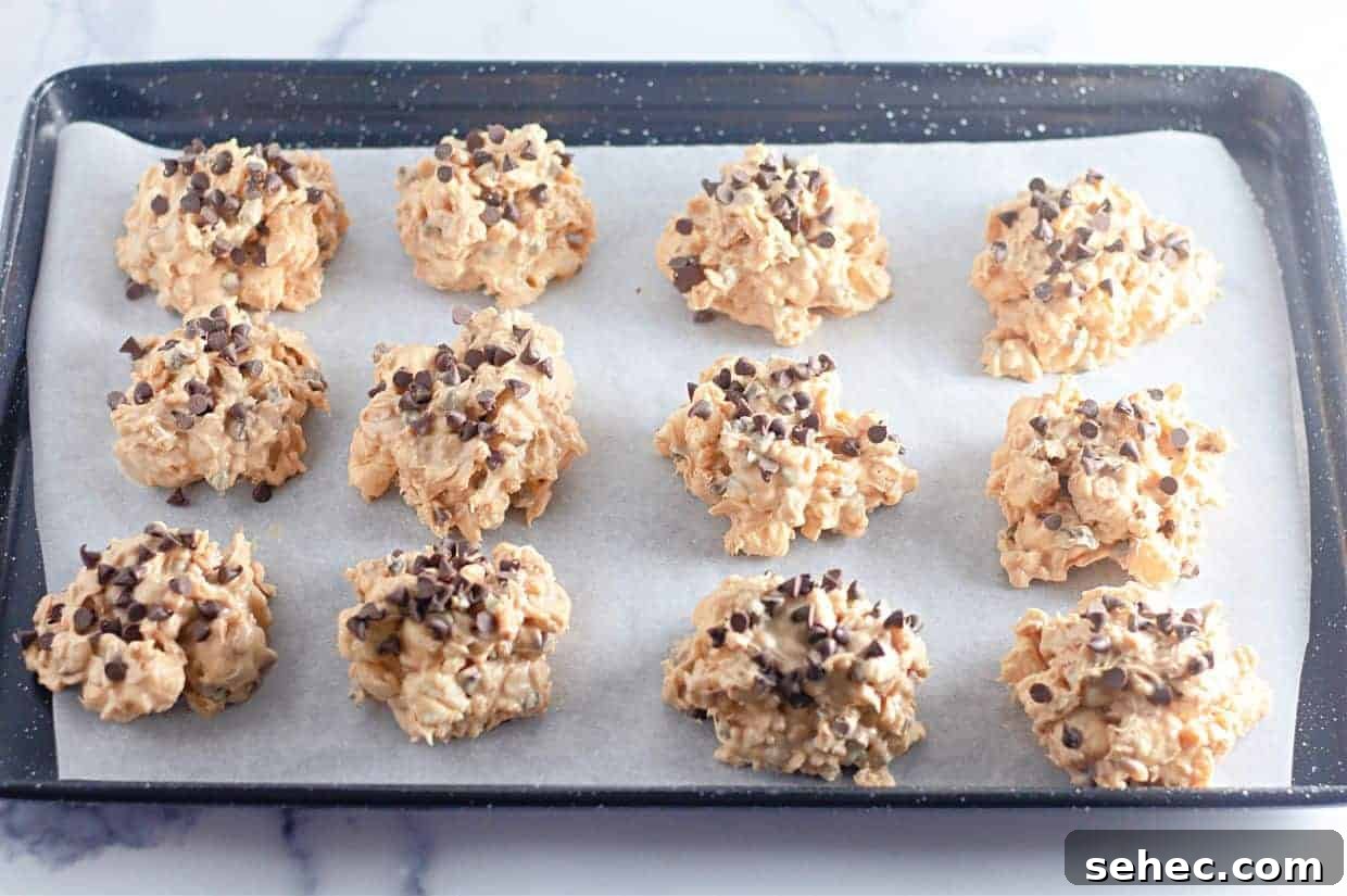 17 Buttery Fall Cookie Recipes for Cozy Shorter Days 3 A baking tray lined with parchment paper holds twelve Avalanche Crunch Cookies.