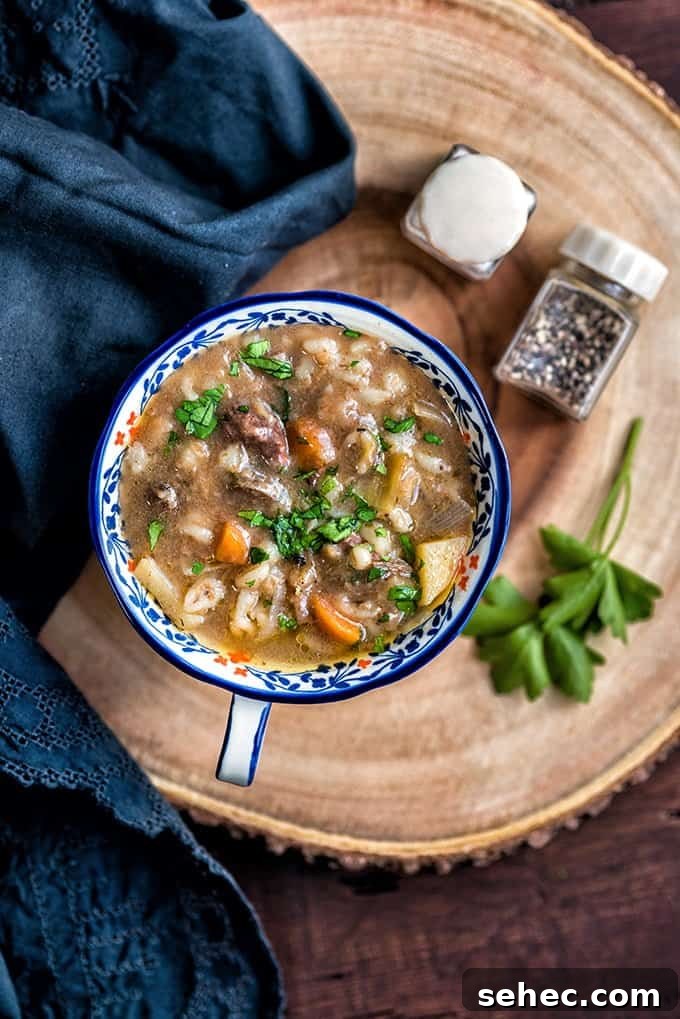 Hearty and delicious slow cooker beef and barley soup - the ultimate comfort food.