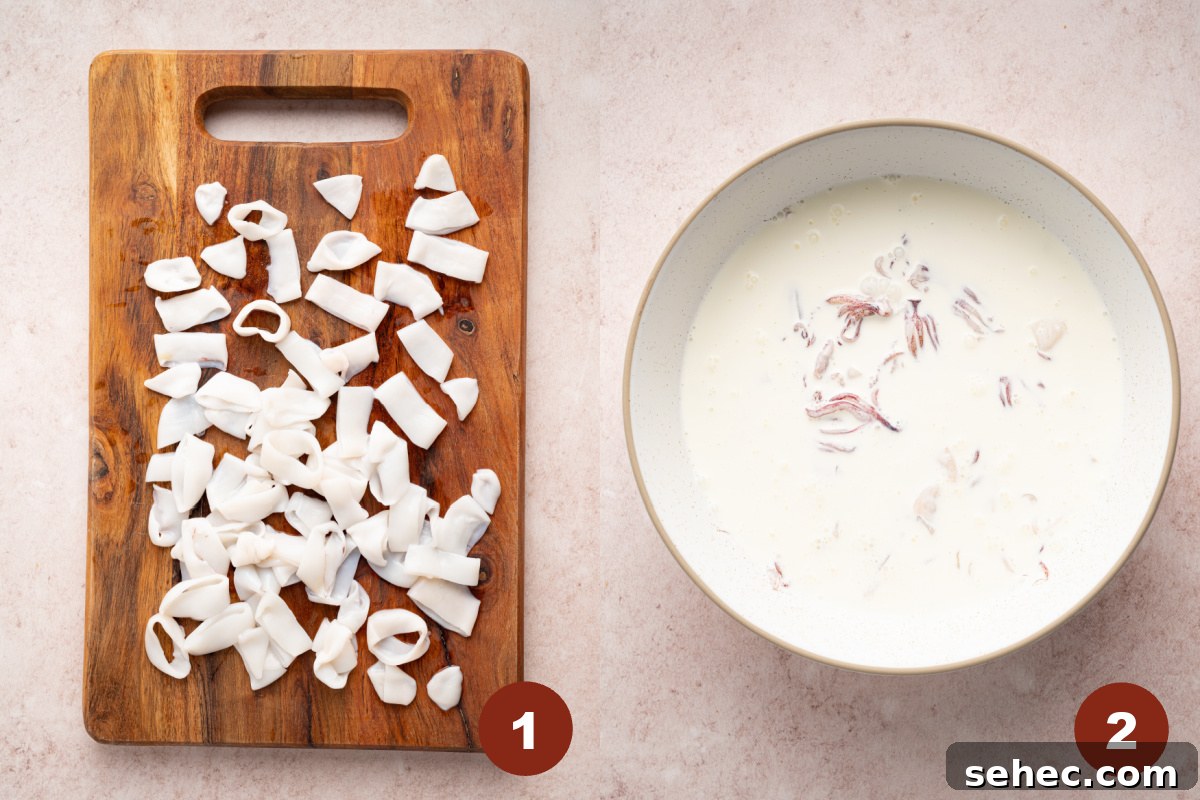 Crispy Fried Calamari with Tender Squid Rings 3 Cut pieces of calamari a wooden cutting board and then a large bowl is also filled with the calamari and heavy cream mixture.