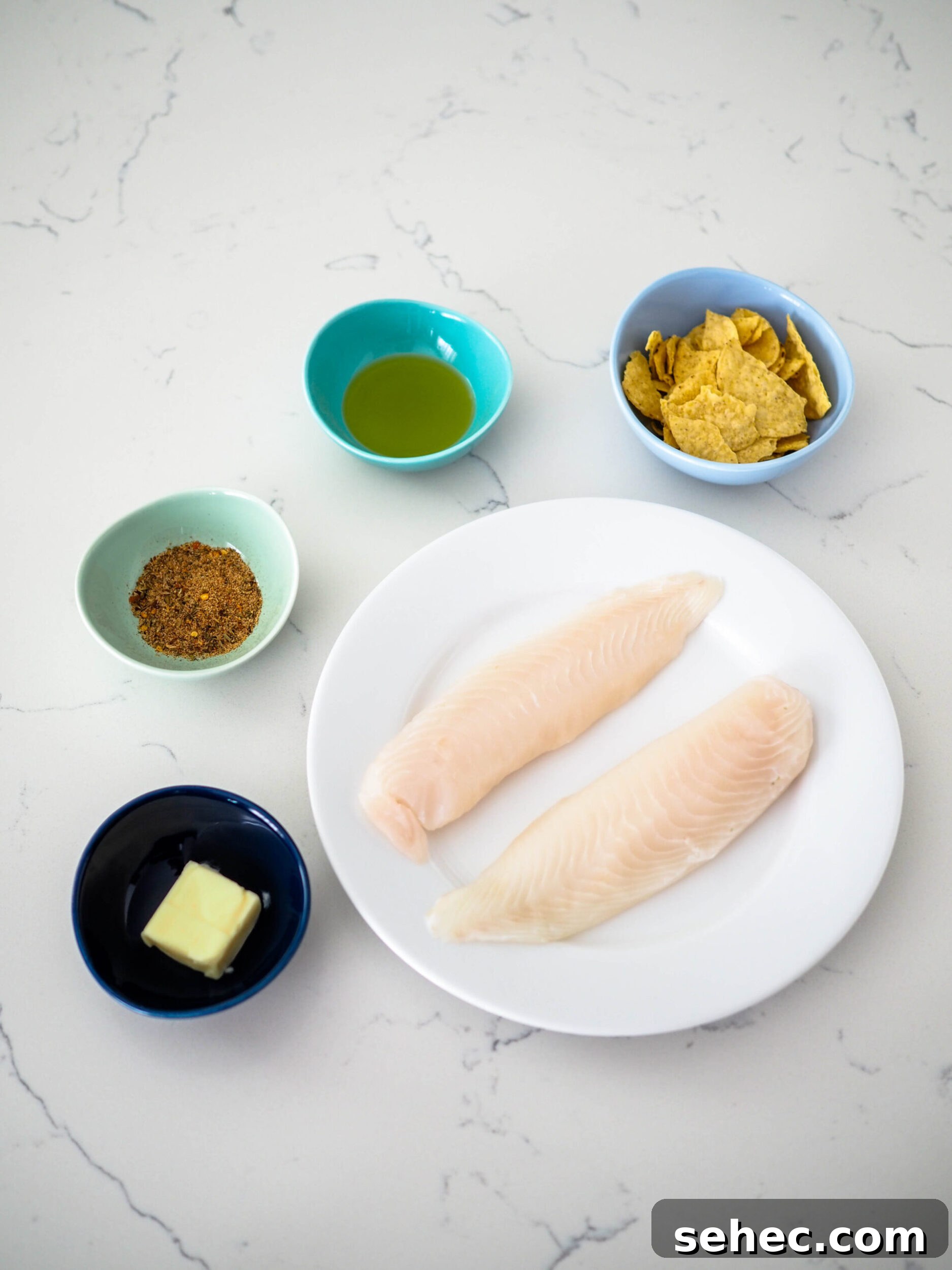 Cajun Tortilla Chip Crusted Tilapia Recipe 3 The five ingredients for cajun tortilla chip-crusted tilapia.