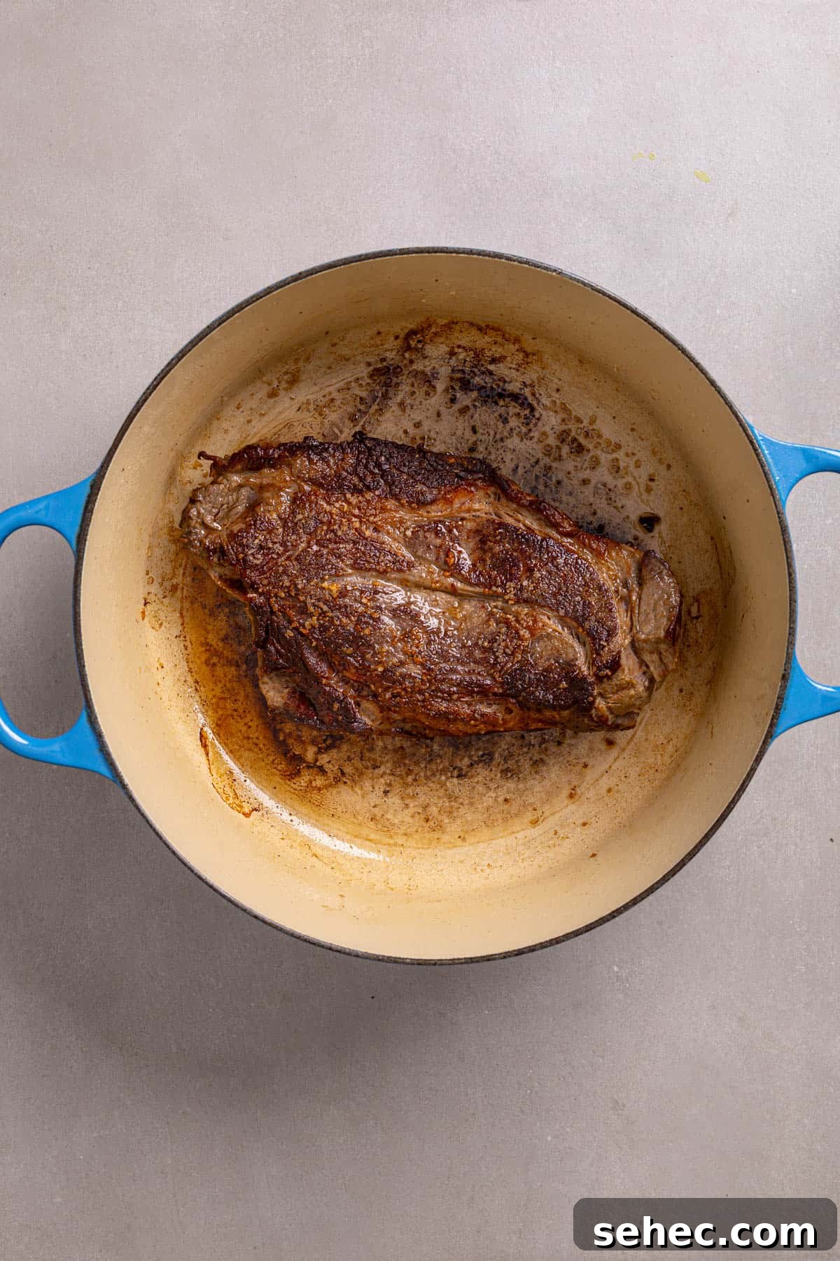 Citrus Soy Braised Chuck Roast Recipe 4 A dutch oven with a chuck roast well browned.