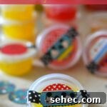 DIY Glitter Slime Party Favors for Kids 2 DIY Party Favors, DIY Glitter Goo, Kids Party Ideas, Kid party favors, mickey mouse party favors, diy disney party,