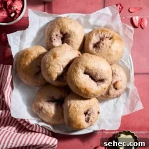 Strawberry Sourdough Discard Bagels 17 Sourdough Discard Strawberry Bagels on a white platter.
