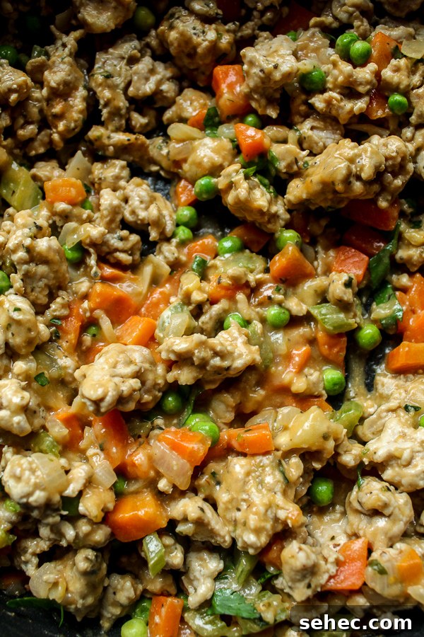 Ground Turkey Shepherds Pie Recipe 3 Delicious ground turkey thickly coated with sauce and mixed with chopped peas, carrots and onions.