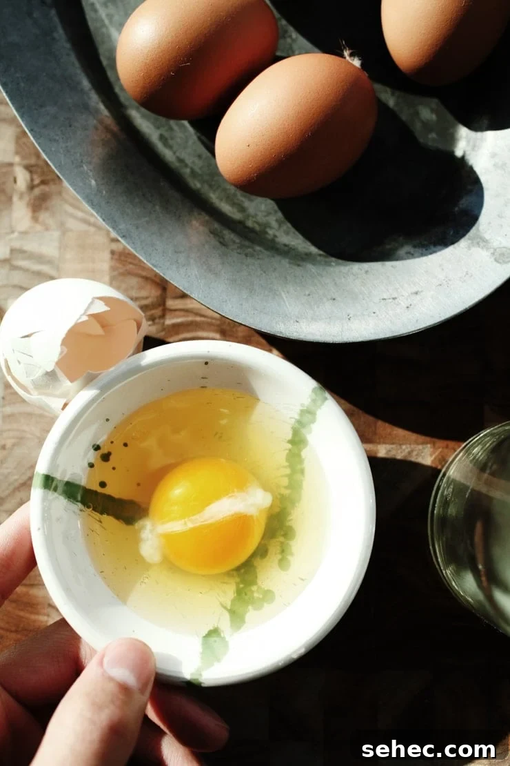 How to Fry an Egg Perfectly Every Time 12 Crack egg into a small bowl