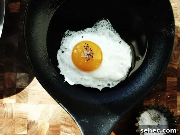 How to Fry an Egg Perfectly Every Time 3 Fried Egg with salt and pepper in Pan