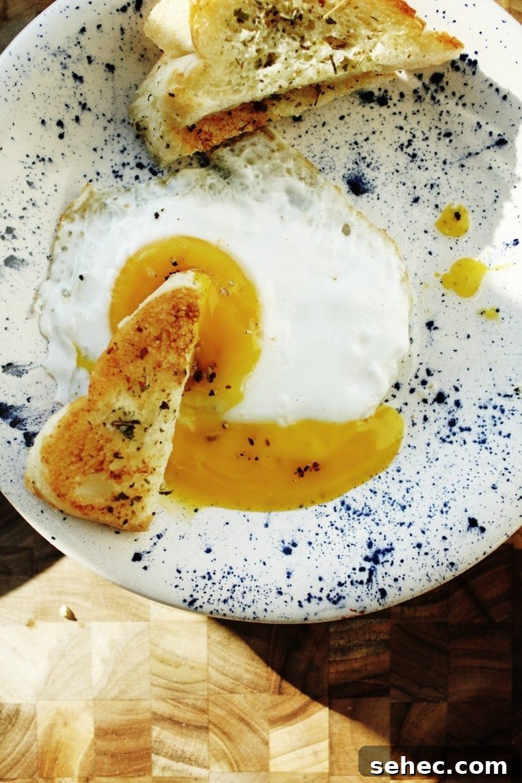 How to Fry an Egg Perfectly Every Time 9 Sunny-side up runny yolk egg with herb toast