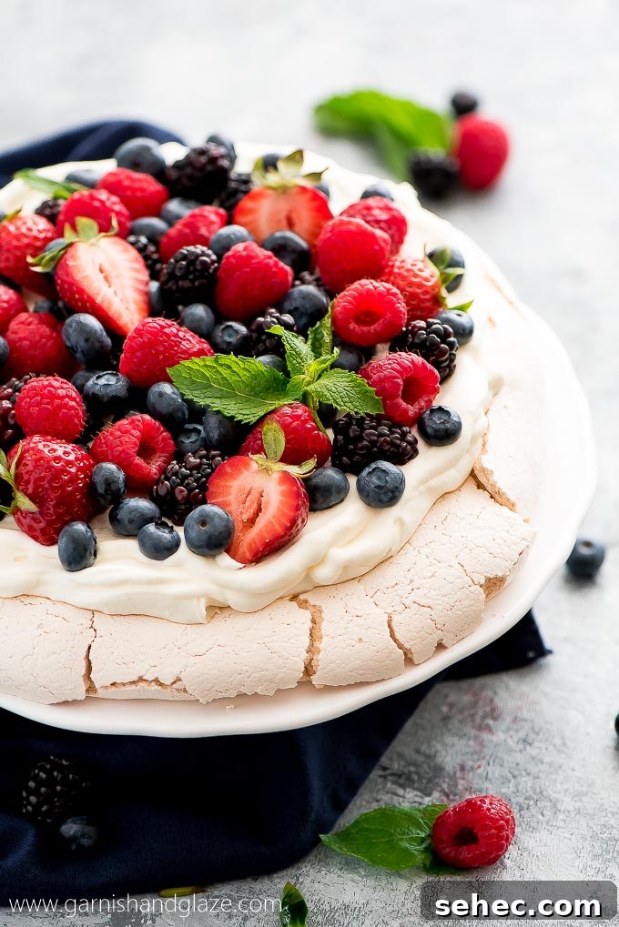 7 Day Family Meal Plan Week 141 9 Mixed Berry Pavlova is the perfect summer party dessert! It's simple, beautiful, refreshing, and a definite crowd pleaser.