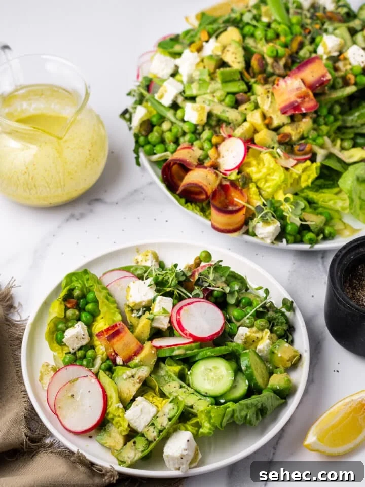 Spring Pea Salad with Lemon Mint Vinaigrette 4 spring pea salad on a small white plate, large serving platter and small glass pitcher of dressing