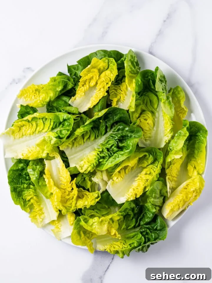 Spring Pea Salad with Lemon Mint Vinaigrette 7 gem lettuce on a white plate