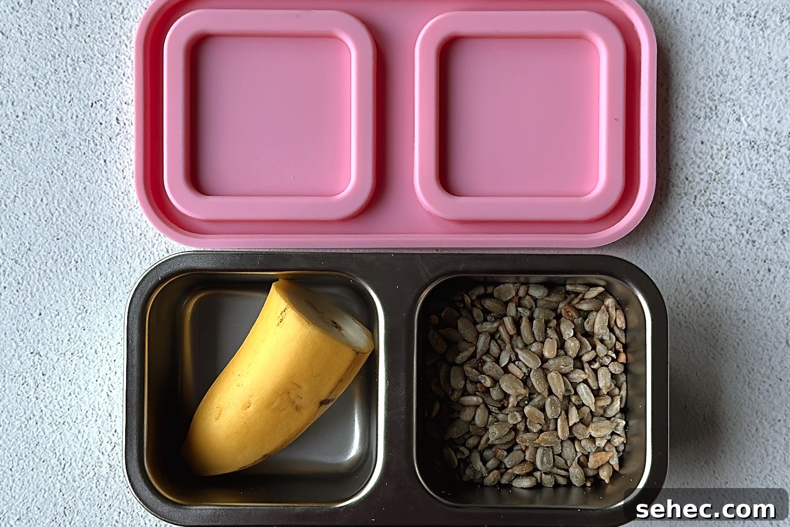 Nutritious School Snacks for Kids to Pack in Lunchboxes 13 Banana and sunflower seeds snackbox.