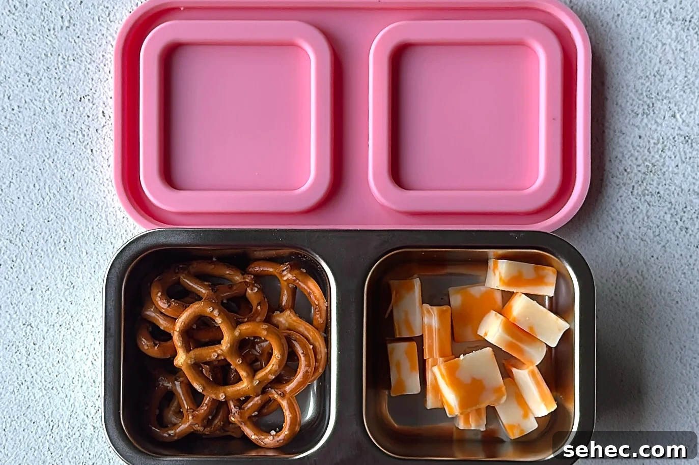 Nutritious School Snacks for Kids to Pack in Lunchboxes 17 Pretzels and cheese snackbox.