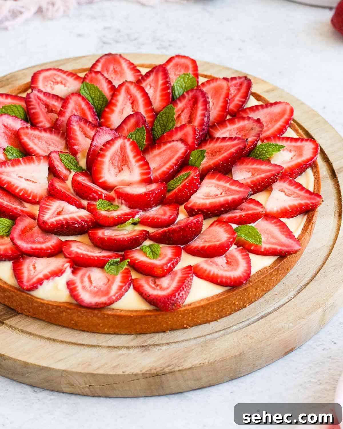 French Strawberry Custard Tart Recipe 8 Close up on the strawberries over the cream filling.