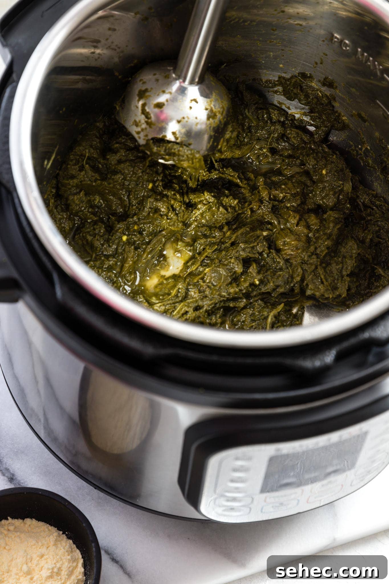 Sarson Ka Saag Recipe Stovetop and Instant Pot 8 Blending greens for Instant Pot Sarson Ka Saag with a hand blender