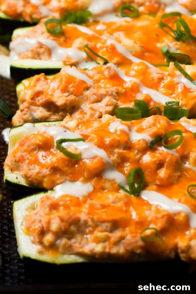 Buffalo Chicken Zucchini Boats Recipe 14 zucchini boats on a baking sheet