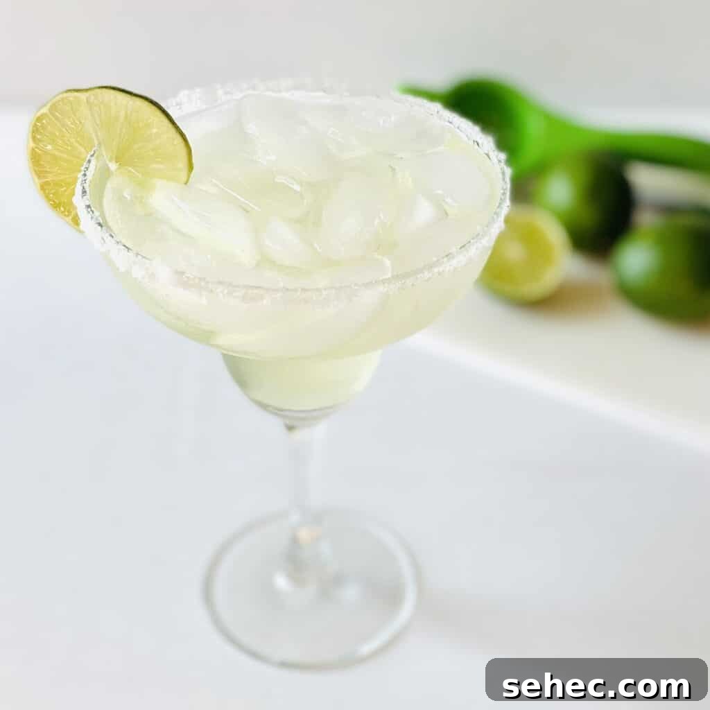 Vodka Margarita Recipe with Fresh Lime 2 vodka-margarita-in-glass-limes-in-background