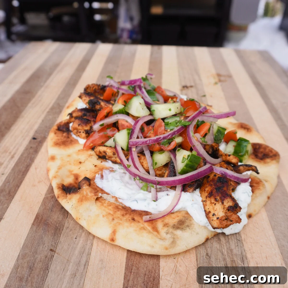 Grilled Chicken Shawarma Recipe 2 Grilled Chicken Shawarma on a pita.