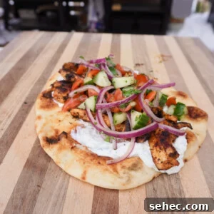 Grilled Chicken Shawarma Recipe 15 Grilled Chicken Shawarma on a pita.