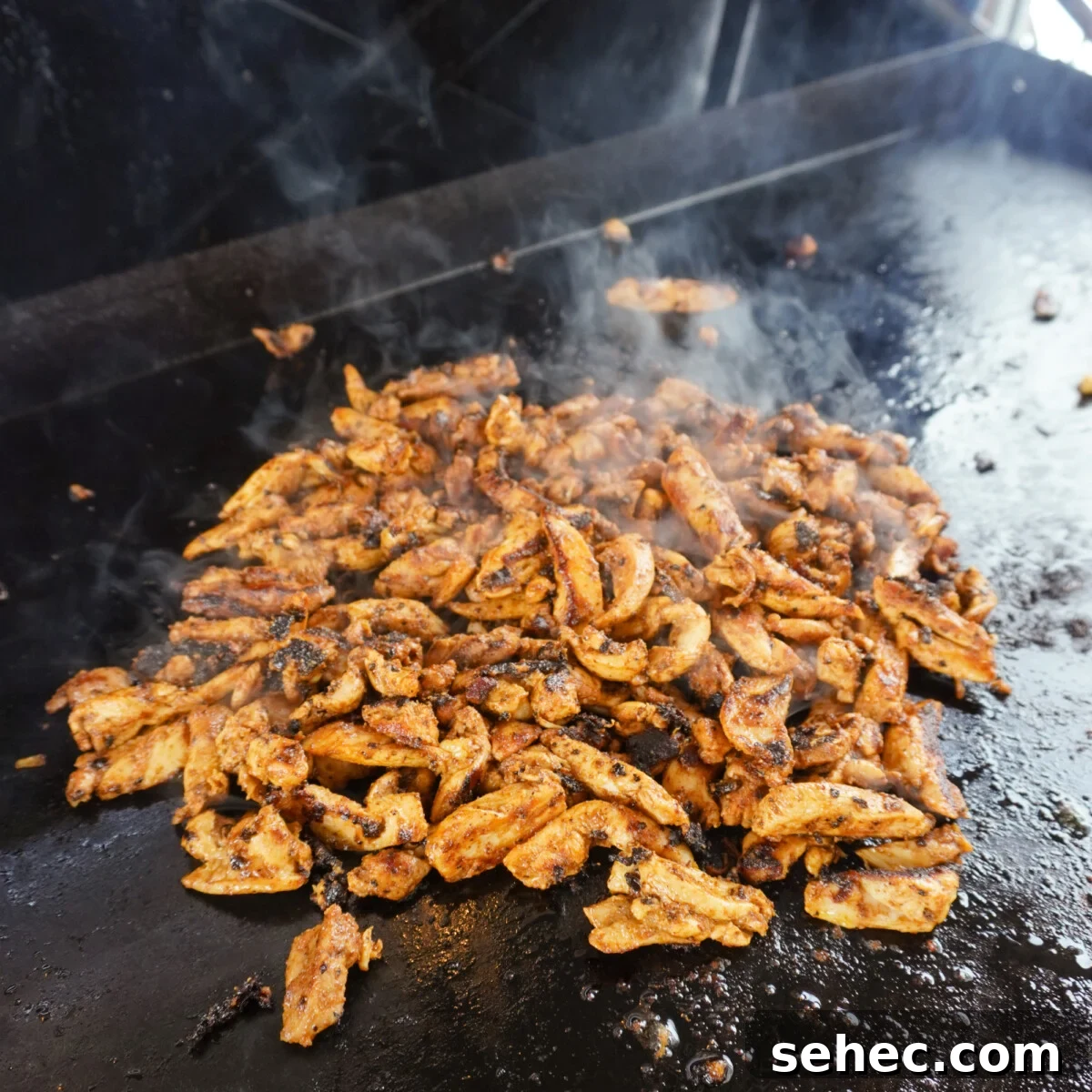 Grilled Chicken Shawarma Recipe 8 grilled chicken shawarma on a griddle.