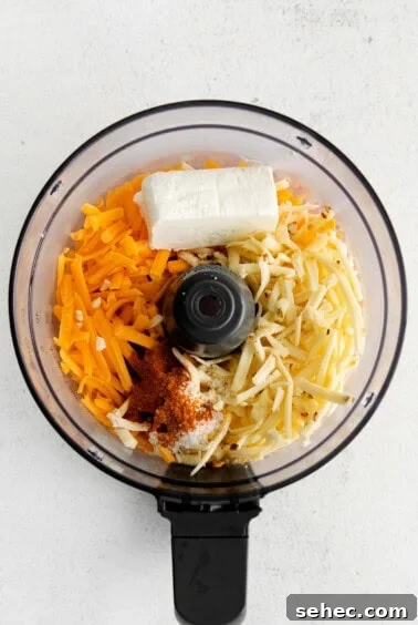 Homemade Cheese Spread Recipe 3 A food processor with cheese spread ingredients.