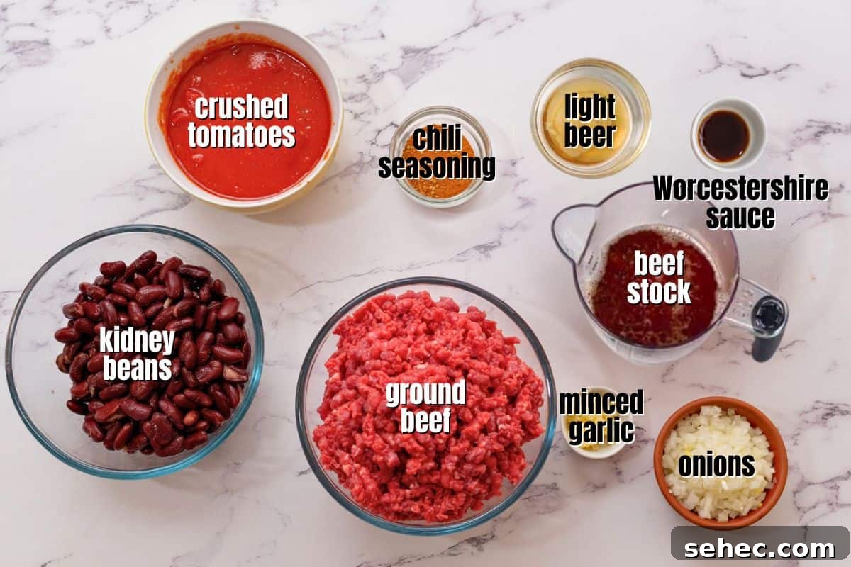 Recipe Instant Pot Chili Ingredients for Instant Pot Chili made with beef and beans labeled on counter.