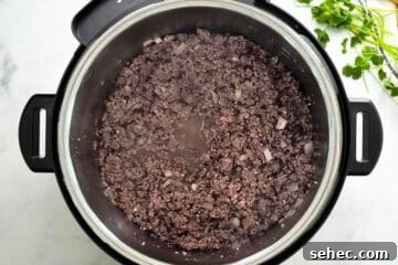 Instant Pot Chili Recipe 3 Ground beef and onion sauteed inside Instant Pot.