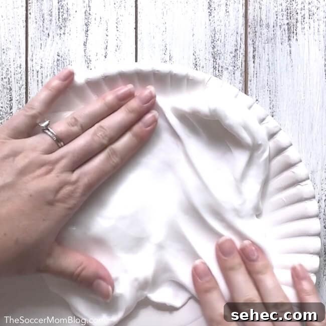Slime Letter Tracing Activity for Kids Video 4 Spreading slime onto paper plate for preschool letter practice