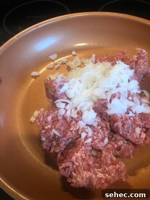 Amish Sausage and Potato Casserole Recipe 4 Sausage and onions in a skillet
