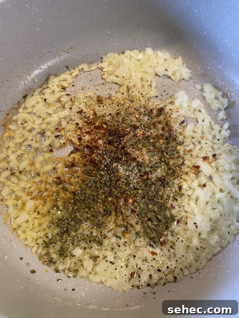 Homemade SpaghettiOs Recipe 7 Diced onions and seasonings in a pan