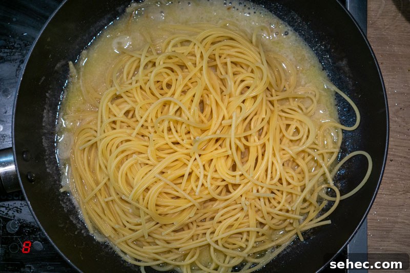 Creamy Lemon Pasta Recipe Without Cream 6 Adding the pasta to the sauce
