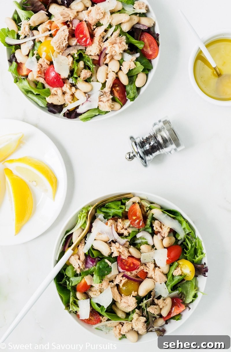 Mediterranean White Bean and Tuna Salad 4 White bean and tuna salad bowls served with lemon and olive oil vinaigrette on the side.