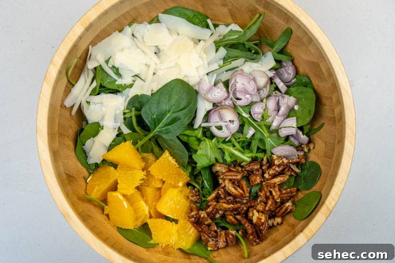 Crisp Spinach and Arugula Salad with Orange and Parmesan 6 Adding everything to a bowl