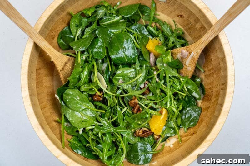 Crisp Spinach and Arugula Salad with Orange and Parmesan 7 Tossing the salad together