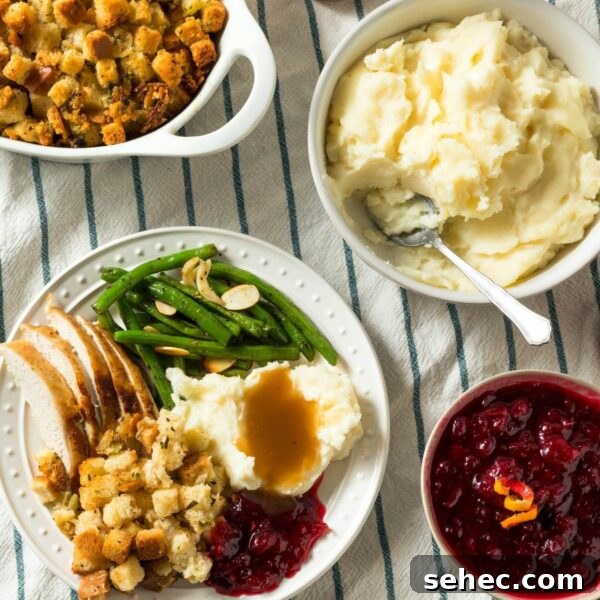 Classic Bread Stuffing Recipe for Thanksgiving 3 turkey dinner on table