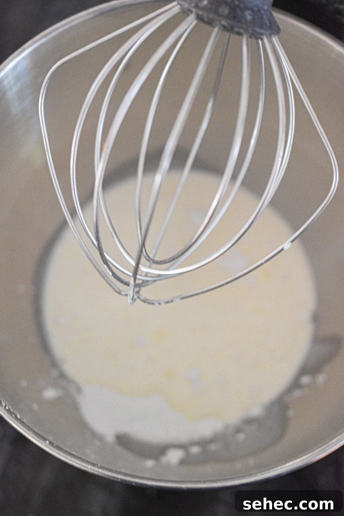 Eggnog Cream Pie Recipe for the Holidays 4 The whipped cream is in the bowl of a stand mixer.