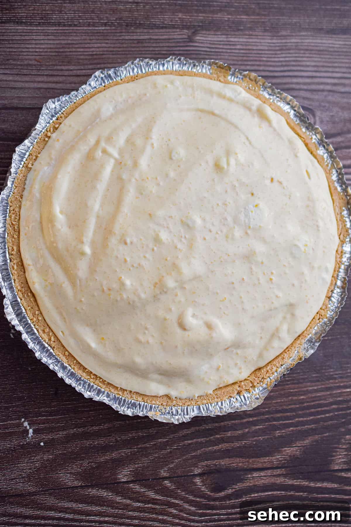 Eggnog Cream Pie Recipe for the Holidays 8 The mixture is poured into the graham cracker crust.