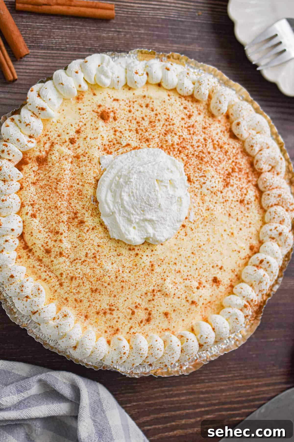 Eggnog Cream Pie Recipe for the Holidays 9 Whipped cream is decorated on top of the no-bake eggnog pie.