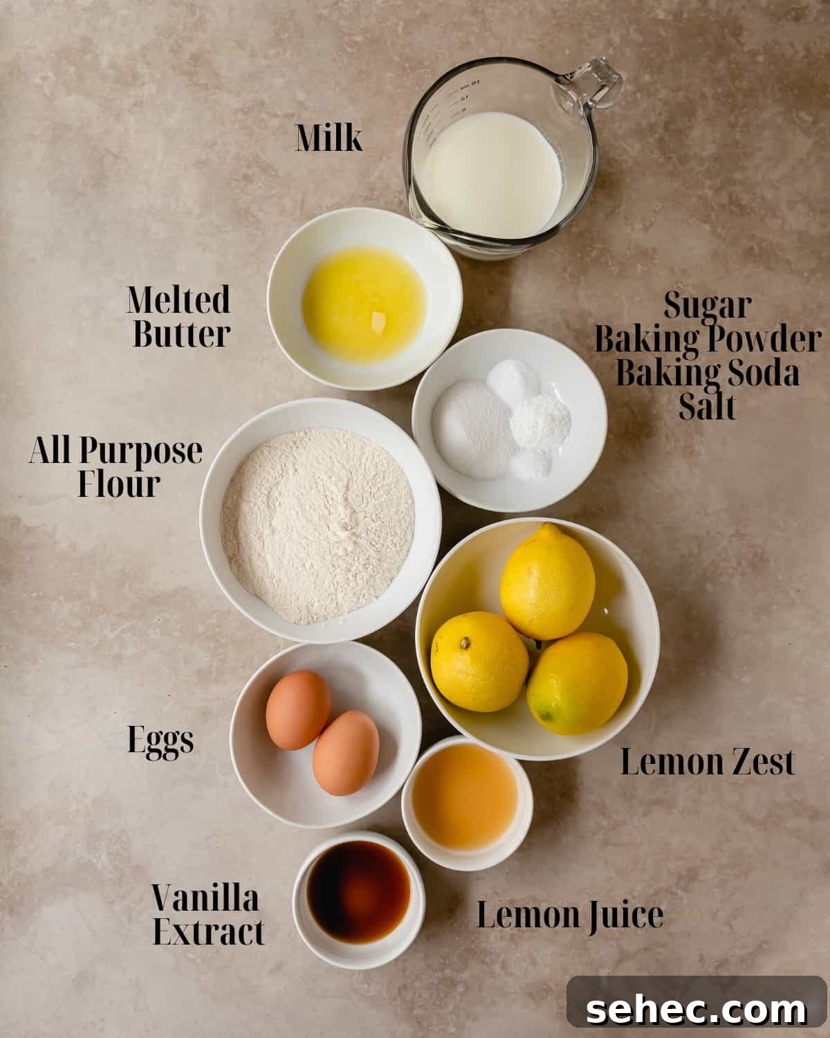 Fluffy Lemon Pancakes with Fresh Citrus Flavor 3 Lemon Pancakes ingredients including all purpose flour, baking powder, baking soda, salt, melted butter, sugar, eggs, lemon zest, vanilla extract, milk and lemon juice.
