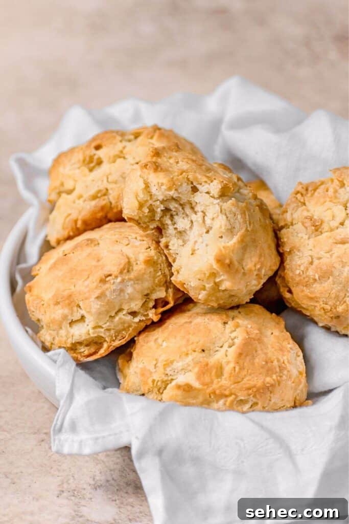 Fluffy Almond Milk Biscuits Recipe 10 bite shot of Southern buttermilk biscuits made with almond milk in a basket