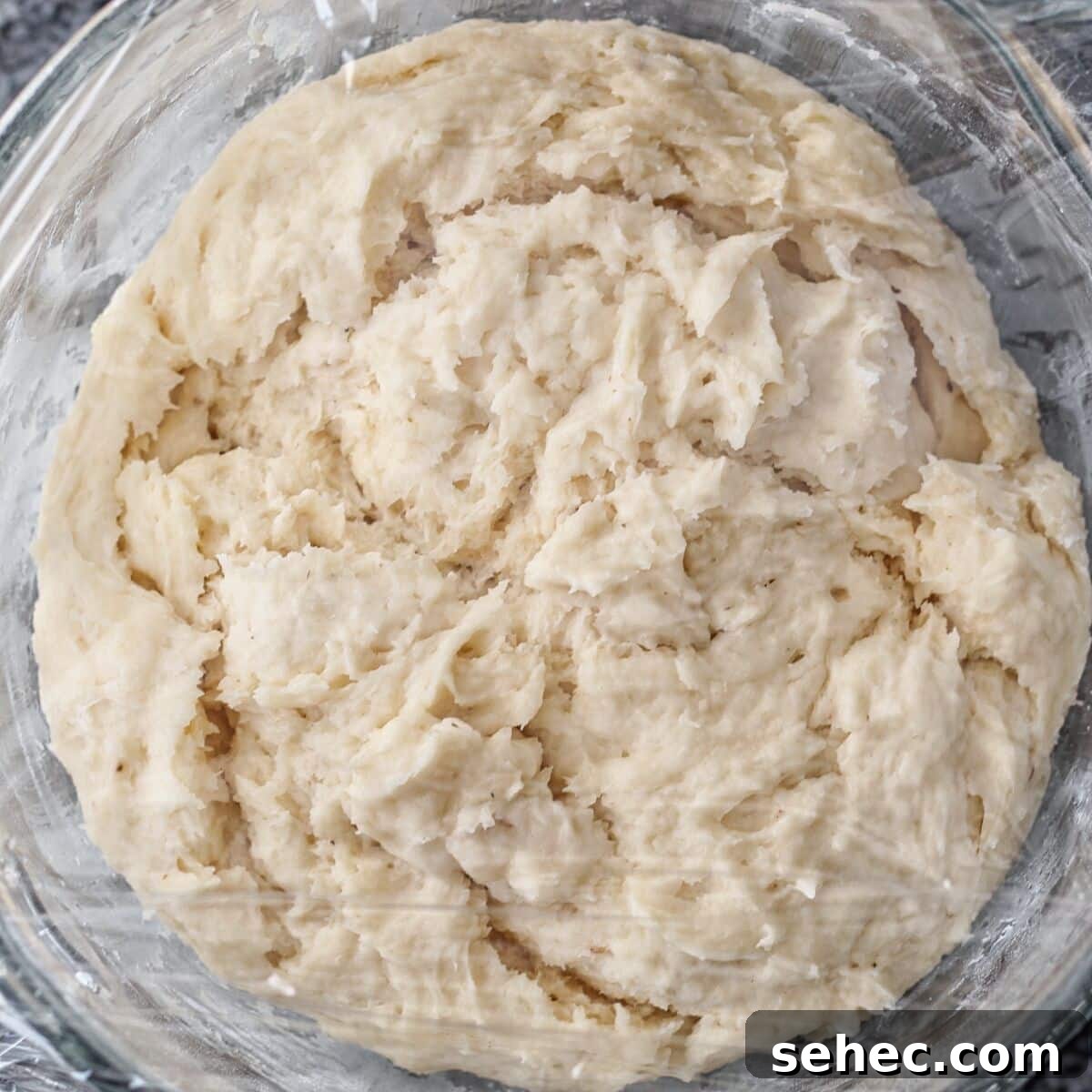 Gluten Free King Cake Recipe for Mardi Gras 7 sweet dough in glass mixing bowl.